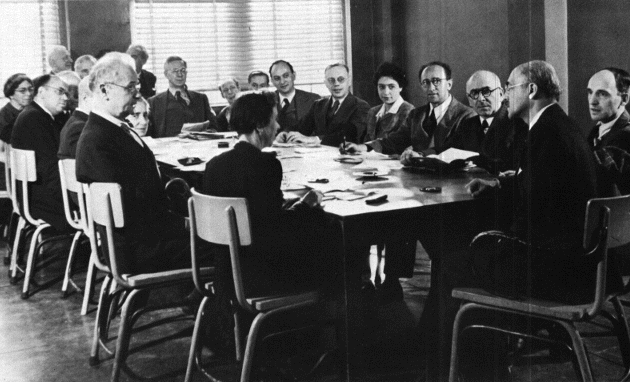 Faculty Meeting at the "University in Exile" in 1946 (click for names)